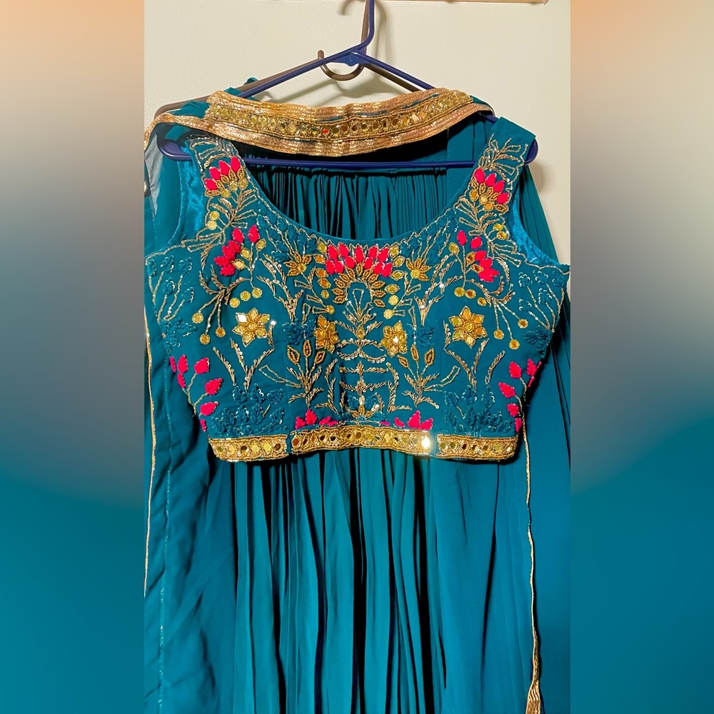 Teal green lehenga with golden work